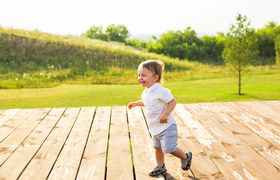Summer, childhood and baby concept – little boy having fun in summer nature.